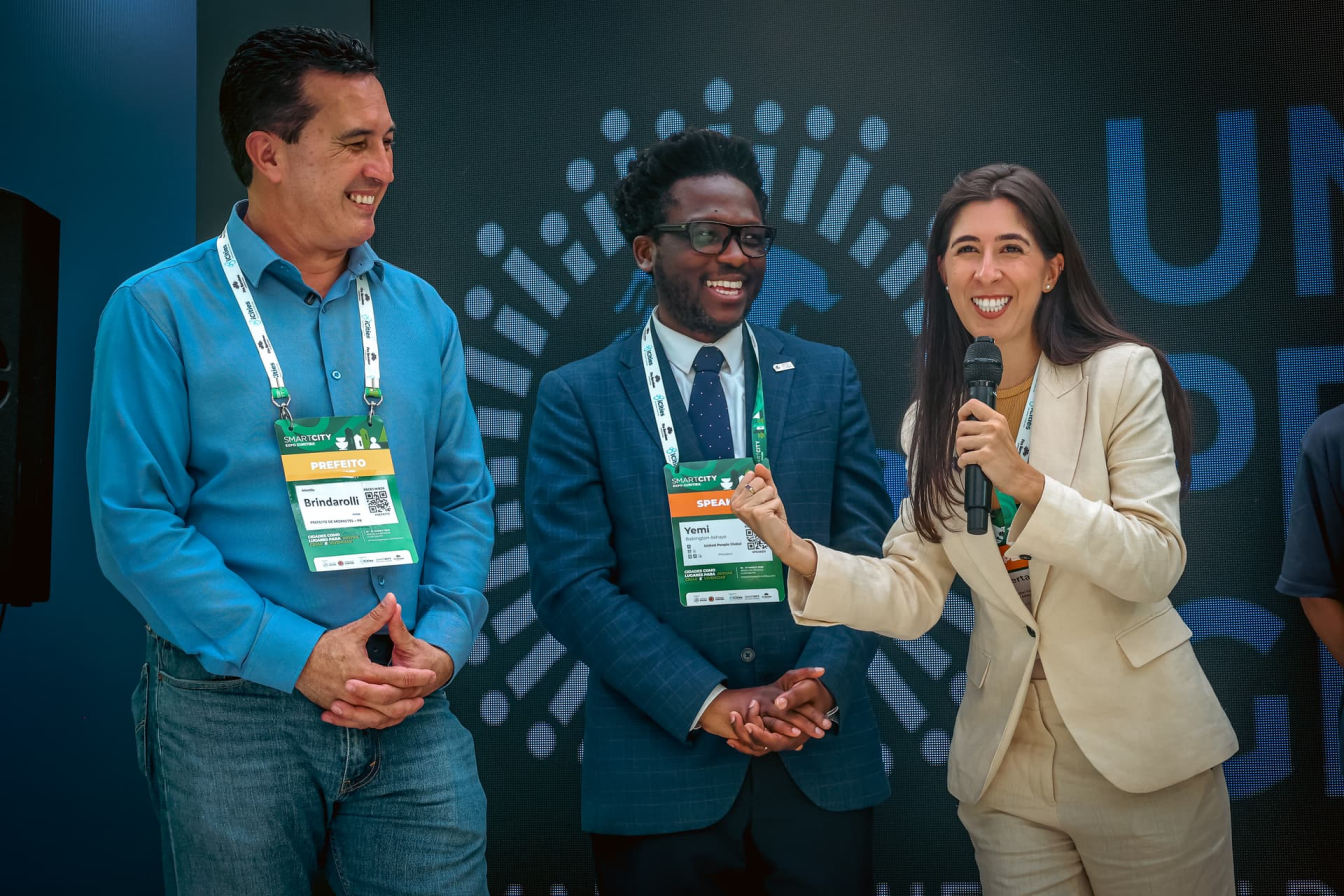 Roberta Moraes speaking at Signing Ceremony with Mayor of Morretes and Yemi